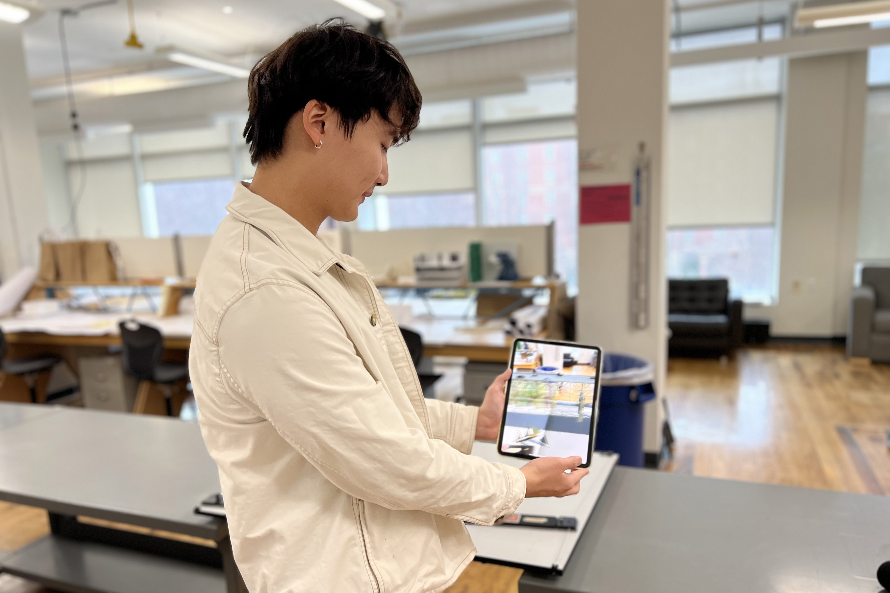 student displays VR technology used in exhibition