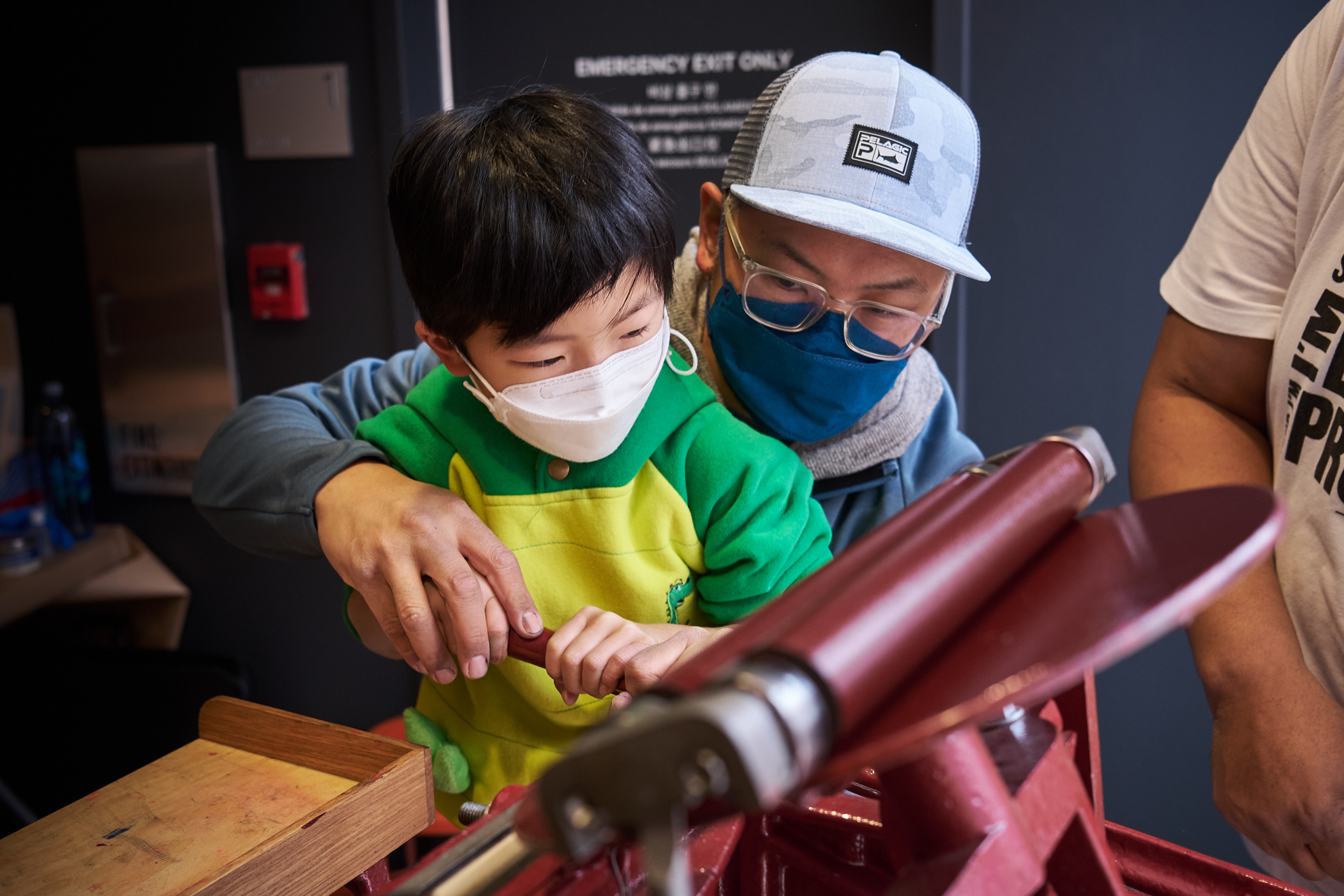 Jaques Bidon poses with a young printmaker