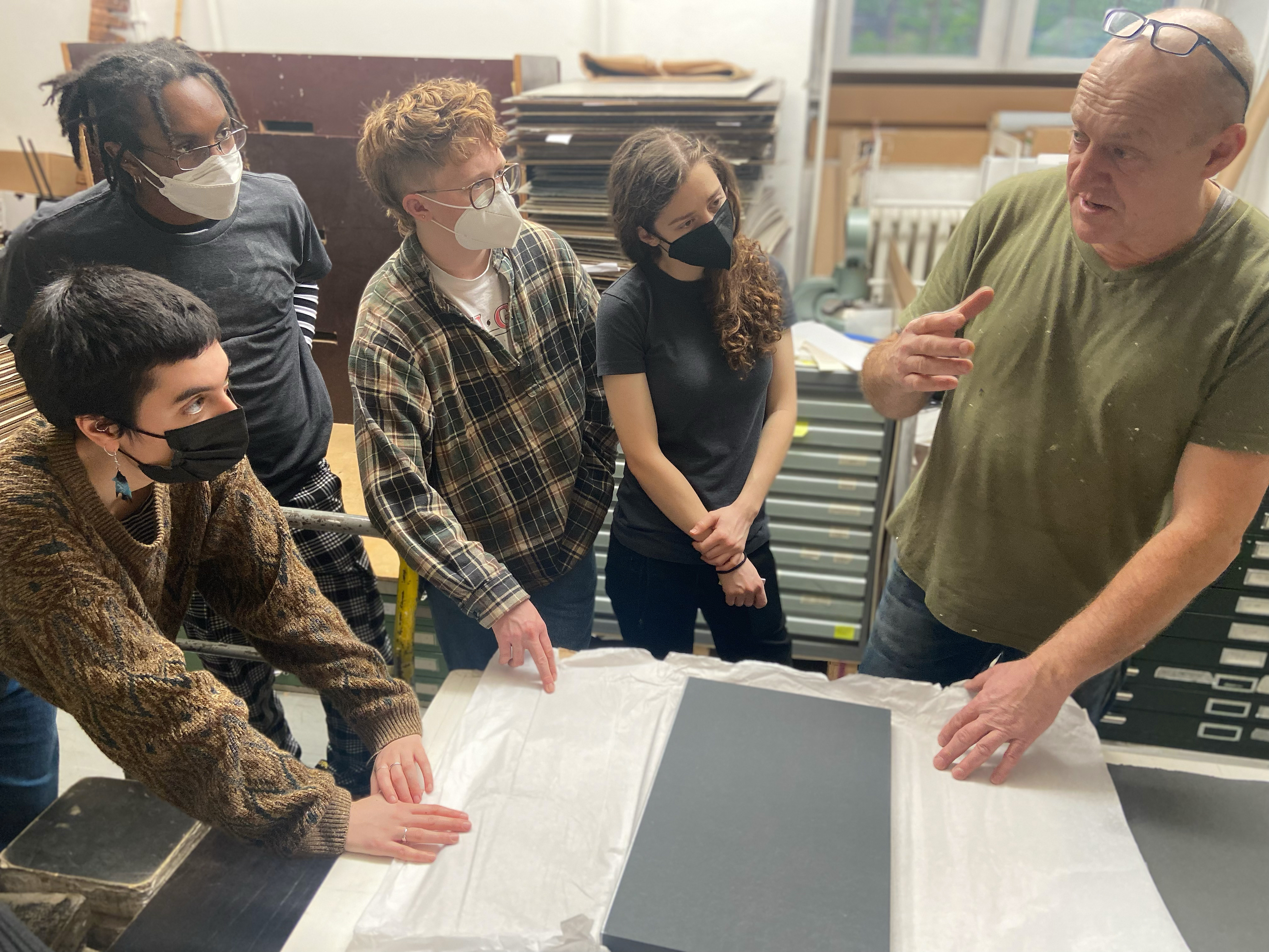 papermaker Gangolf Ulbricht works with students