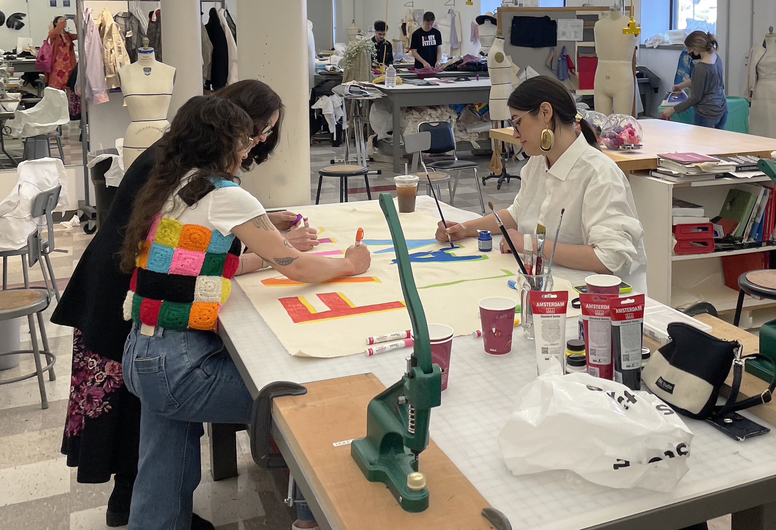 the visiting artists help create signs advocating for workers' rights