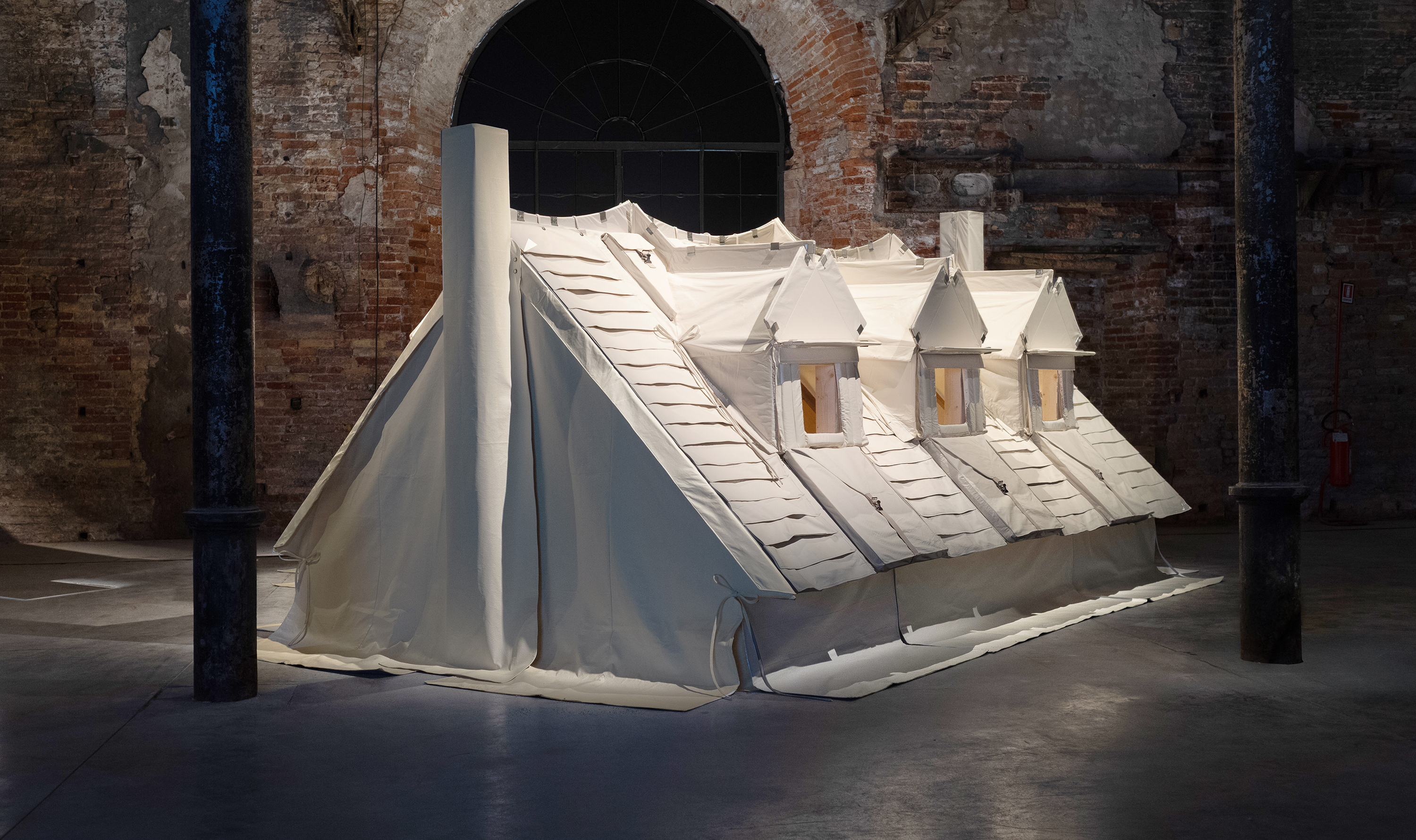 SpaceSuits.US display of a house's roof sheathed in space-age sheeting