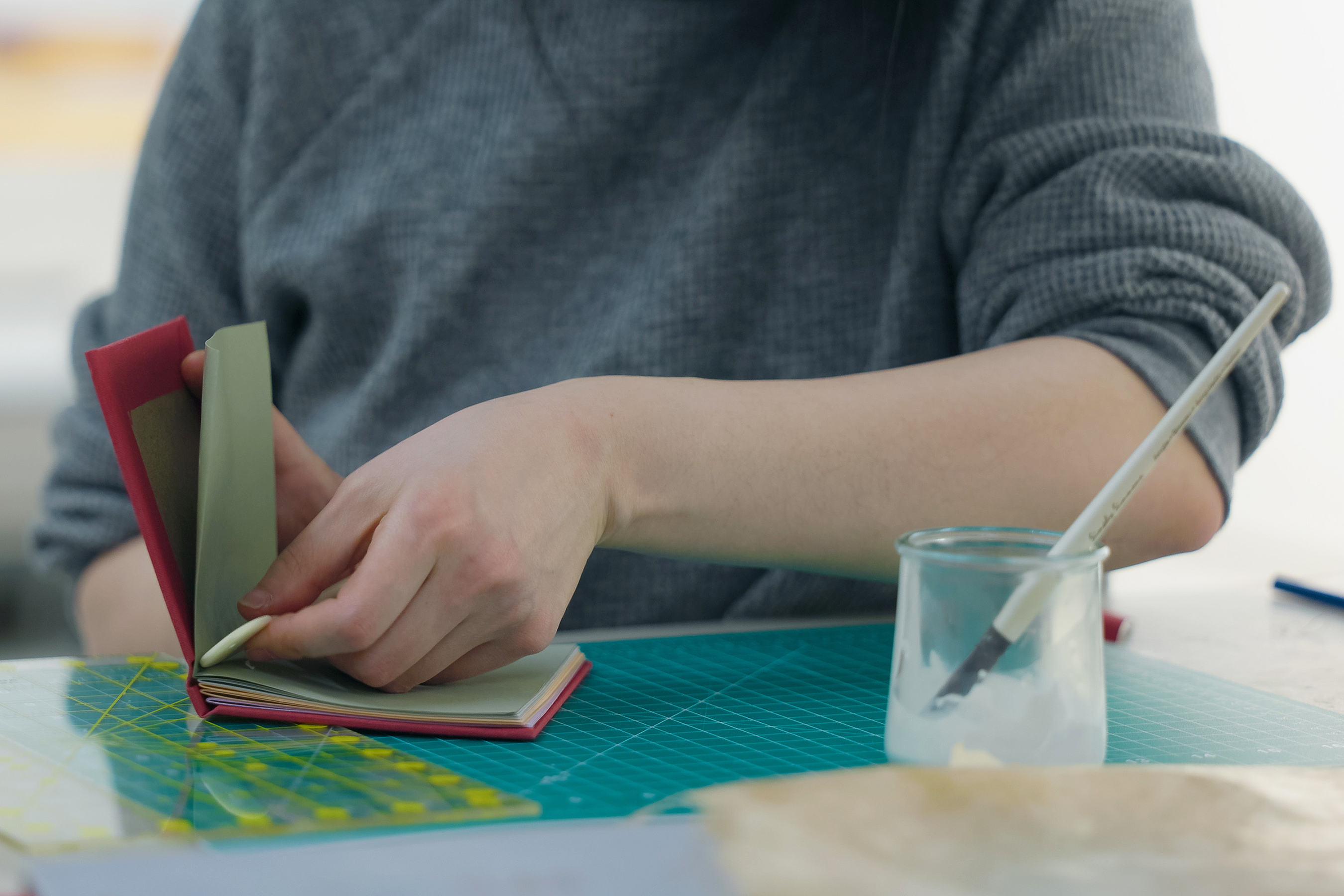 using glue to bind a book in progress