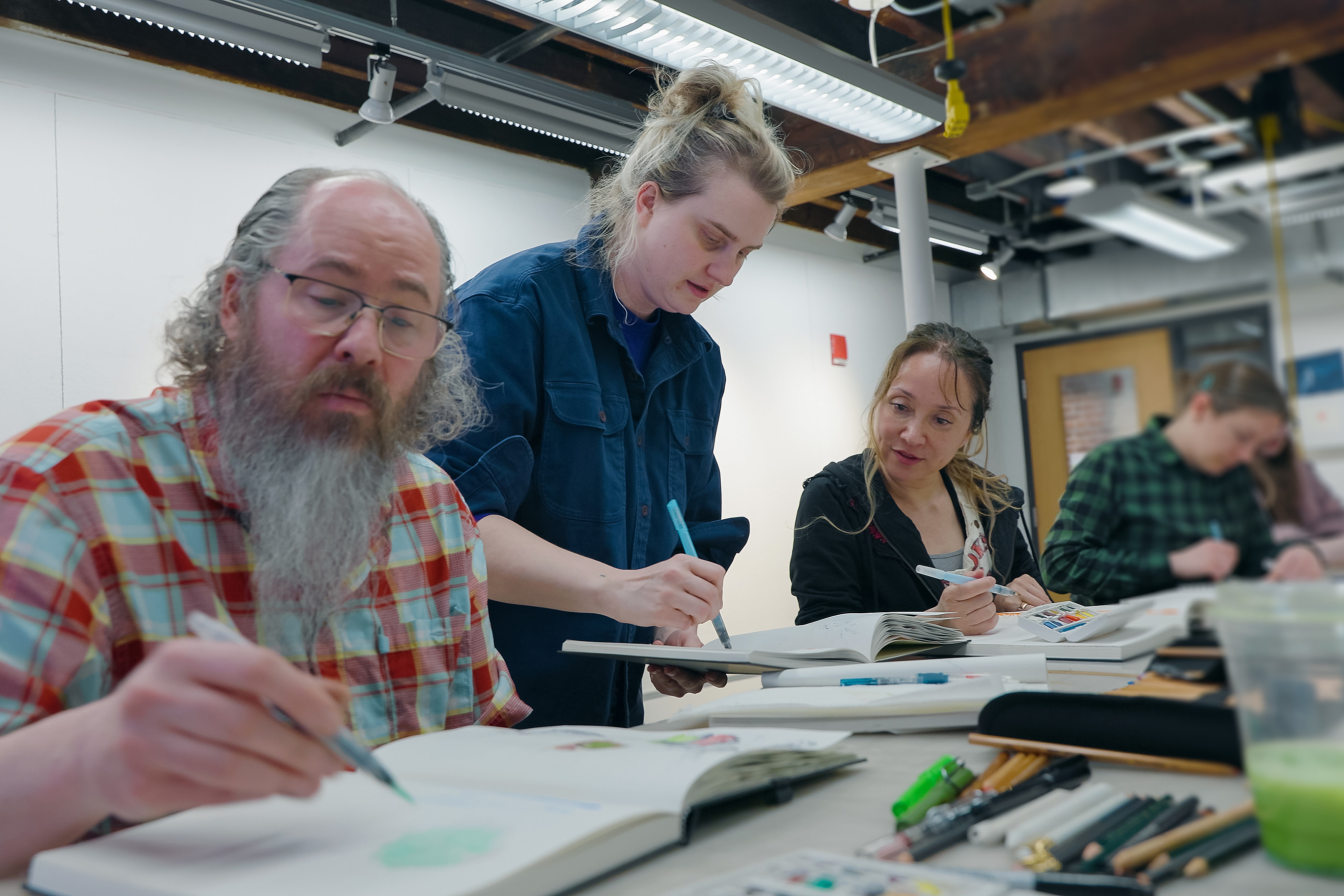 Cathy Johnson leads a course on sketchbook making