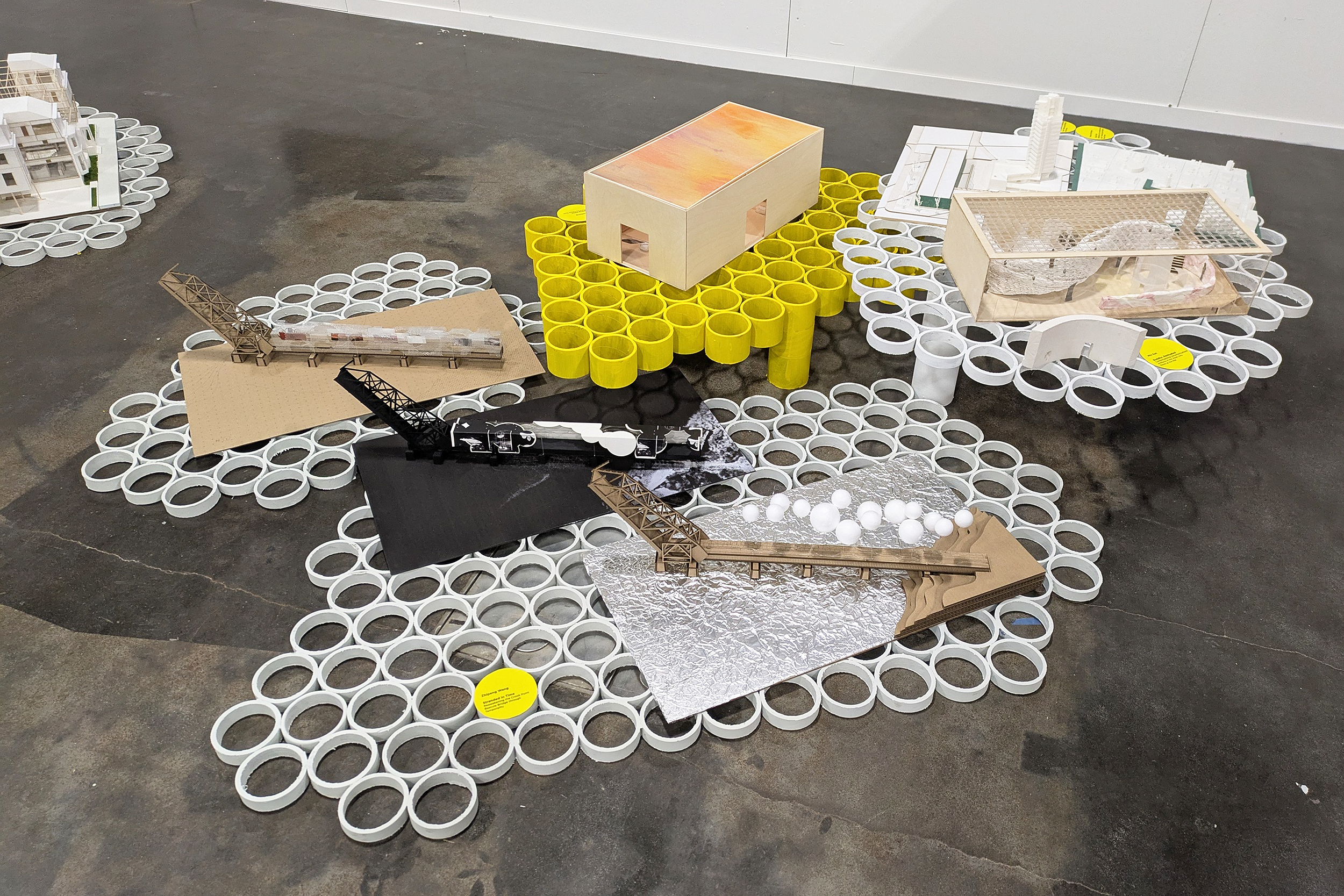 white and yellow tables made from discarded rope spools