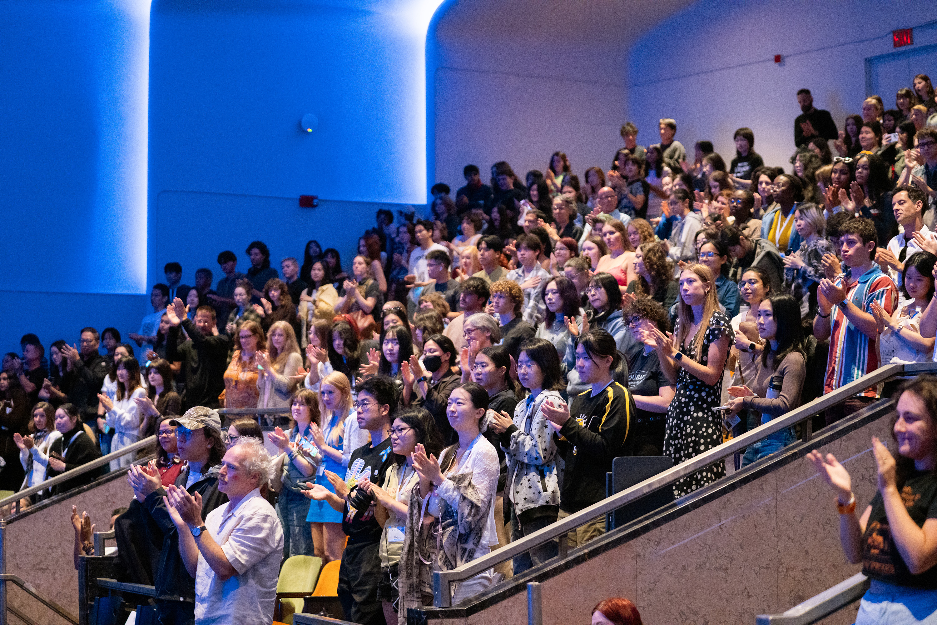 students and staff give Provost Ghadessi a standing ovation