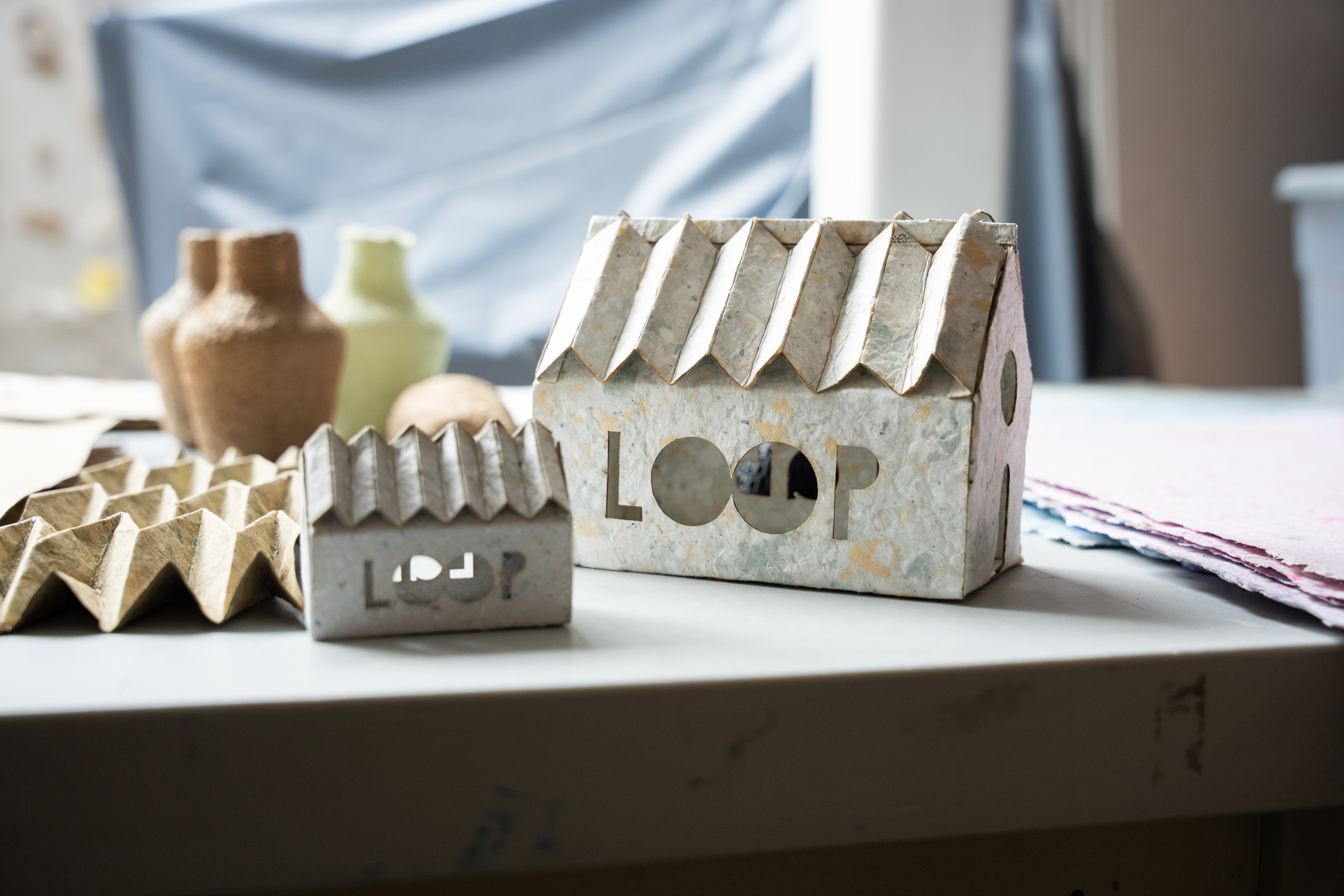 paper structures in the shape of houses