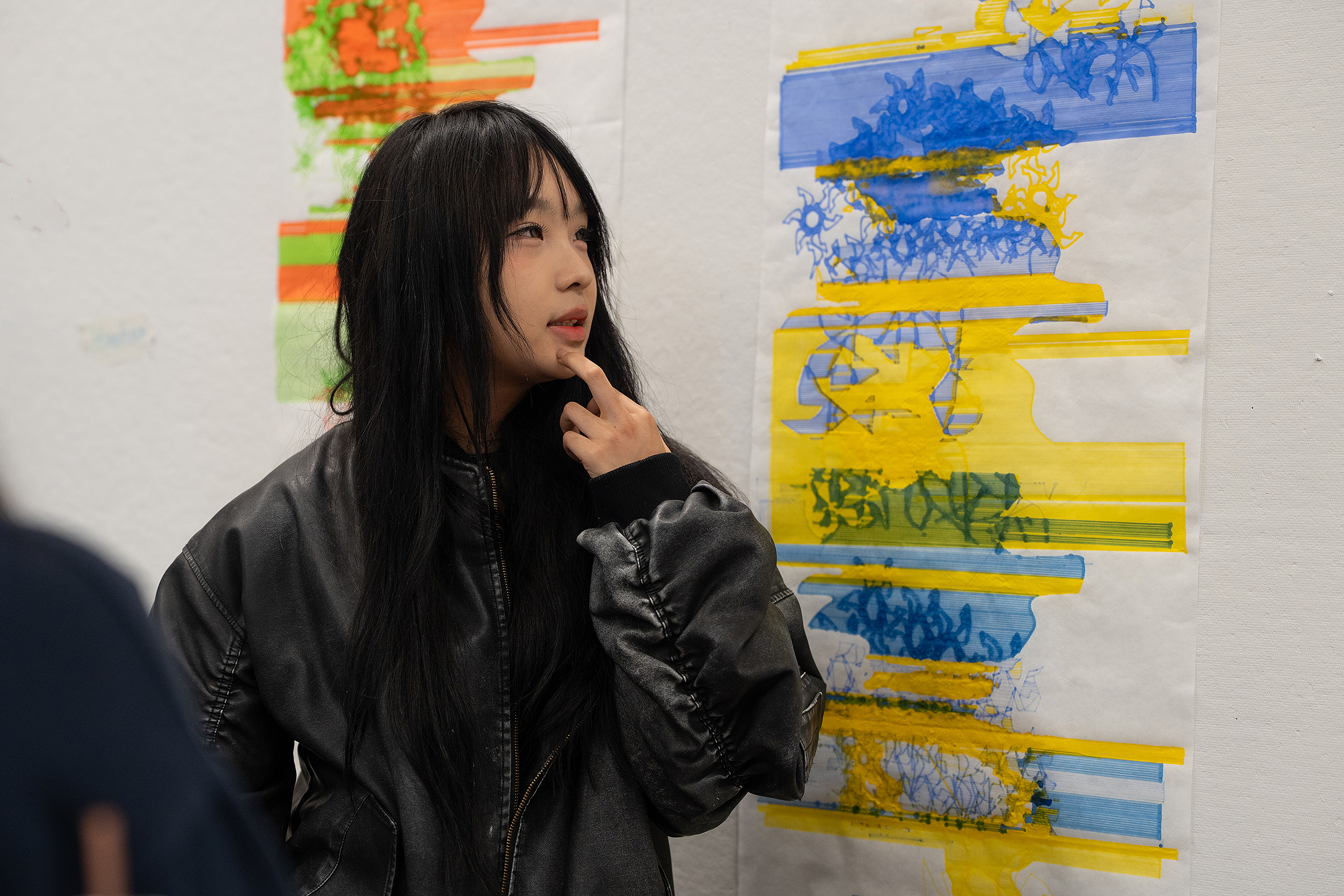 Ivy Han leads a critique about the work of another CTC student