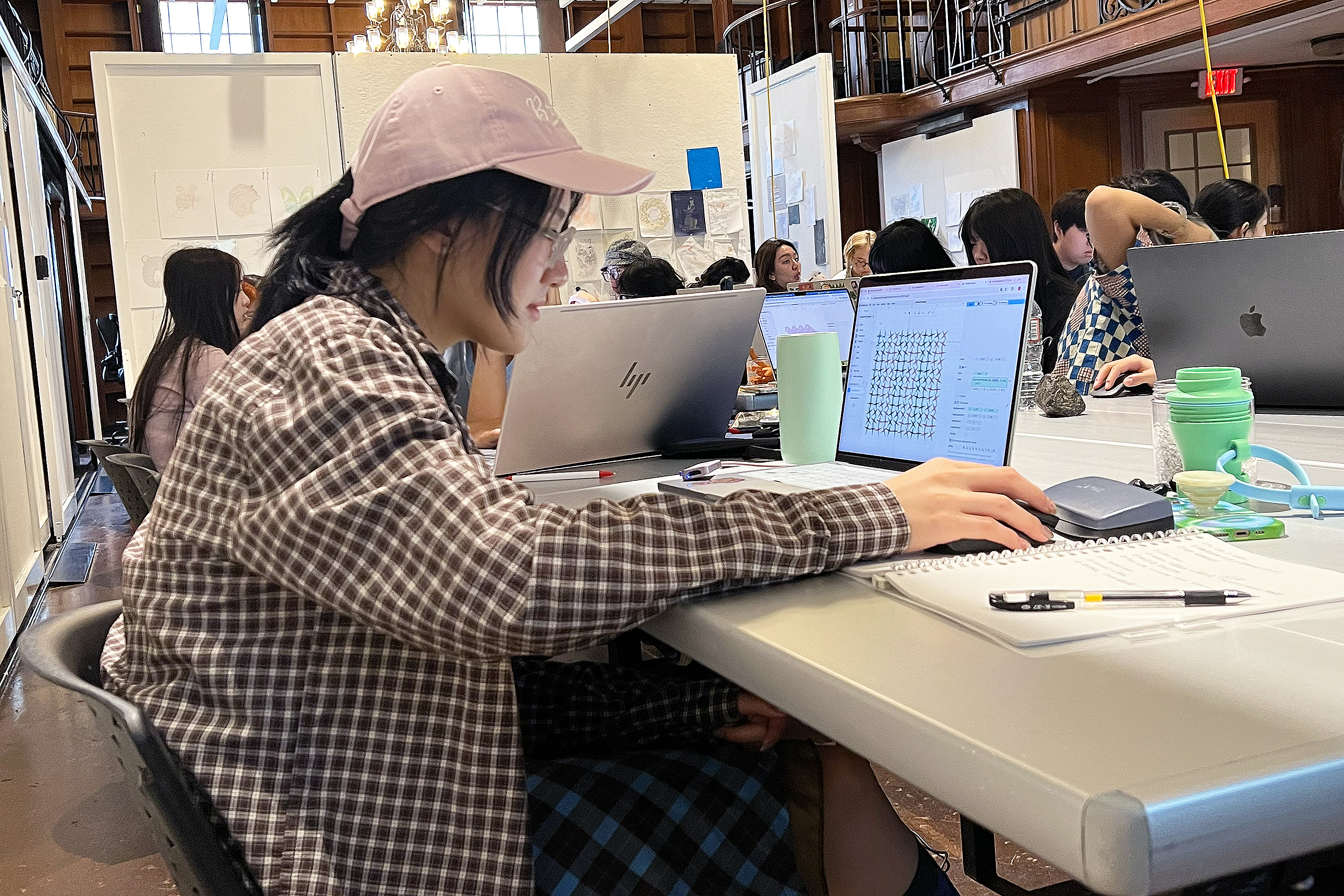 a student works on her computer in class