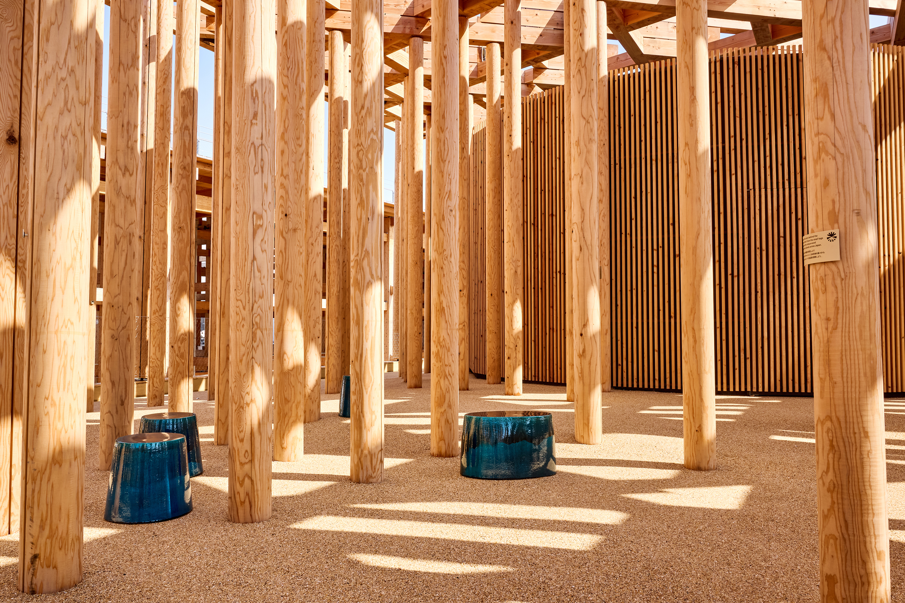 outdoor pavilion featuring beautiful untouched timbers and deep blue vases