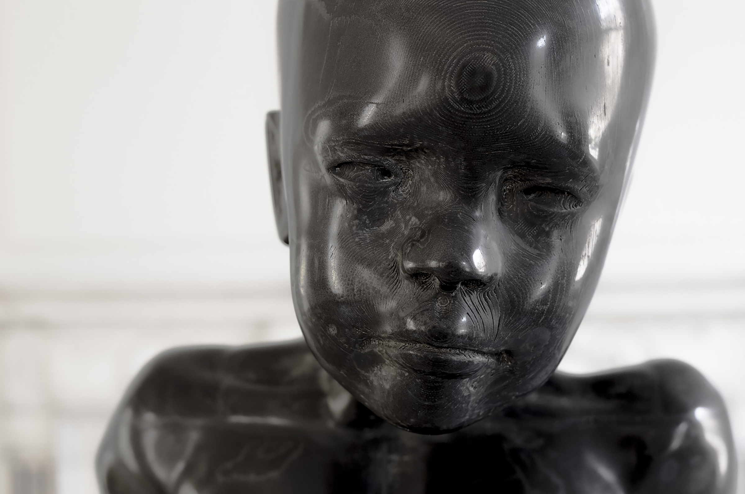 detail of sculpture of a boy's head