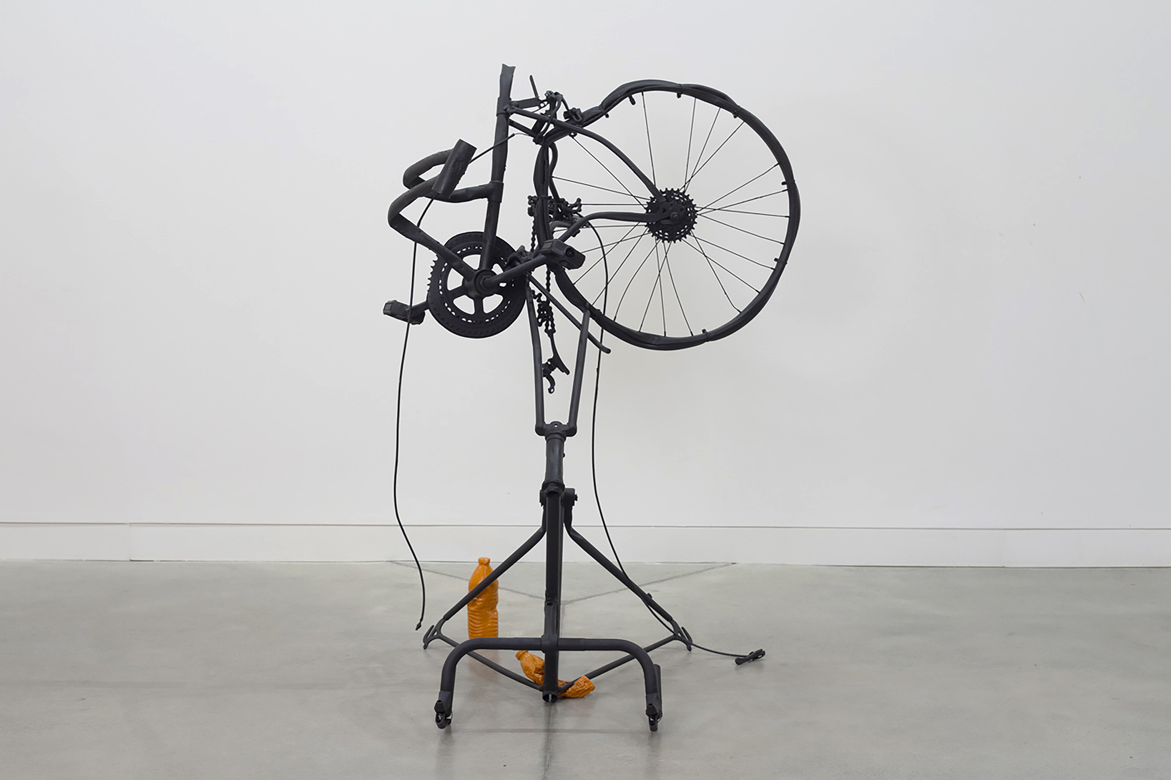 sculpture created out of a broken bicycle