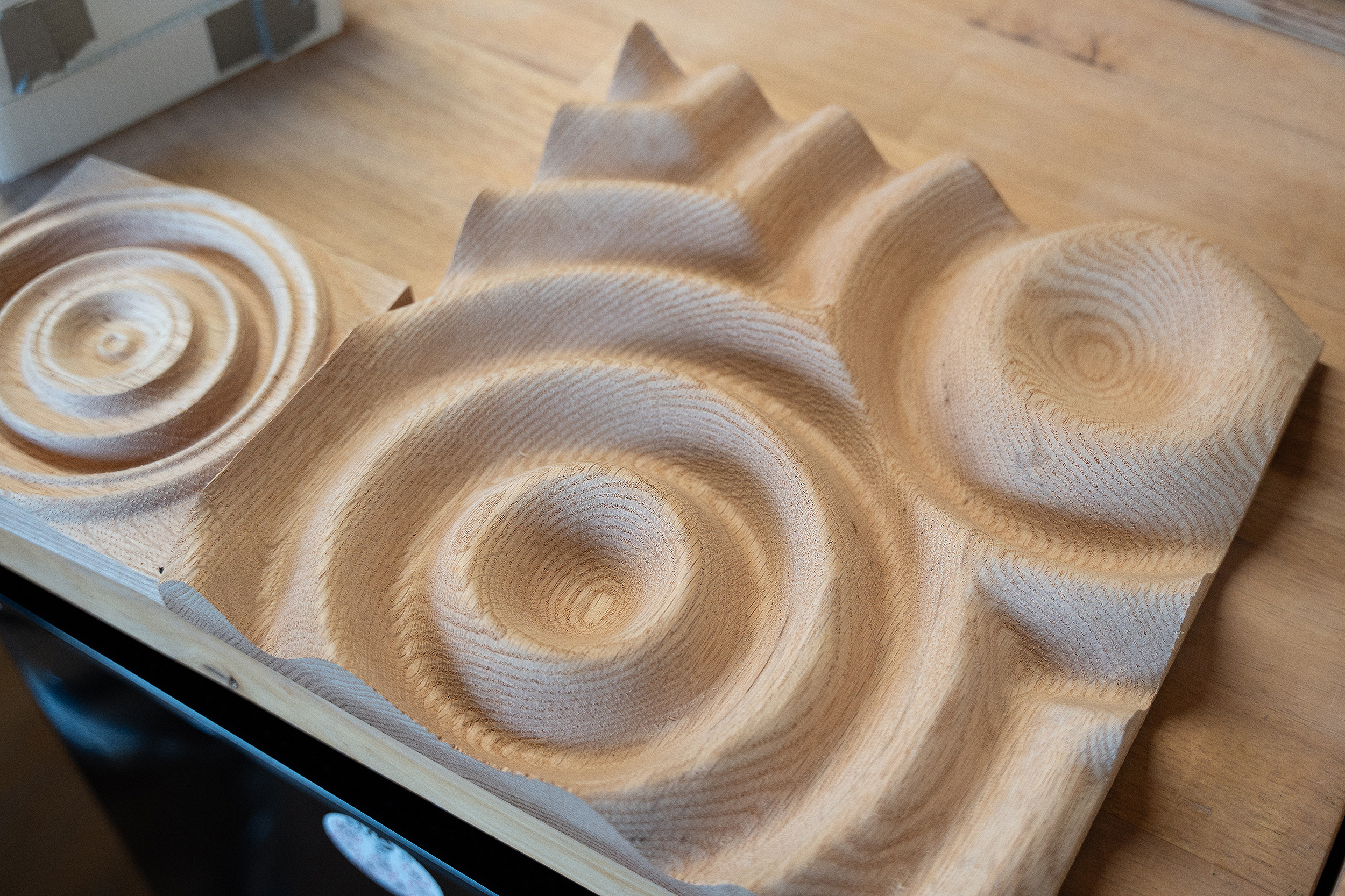 wooden mold with curves and divots to gather biomaterial gel