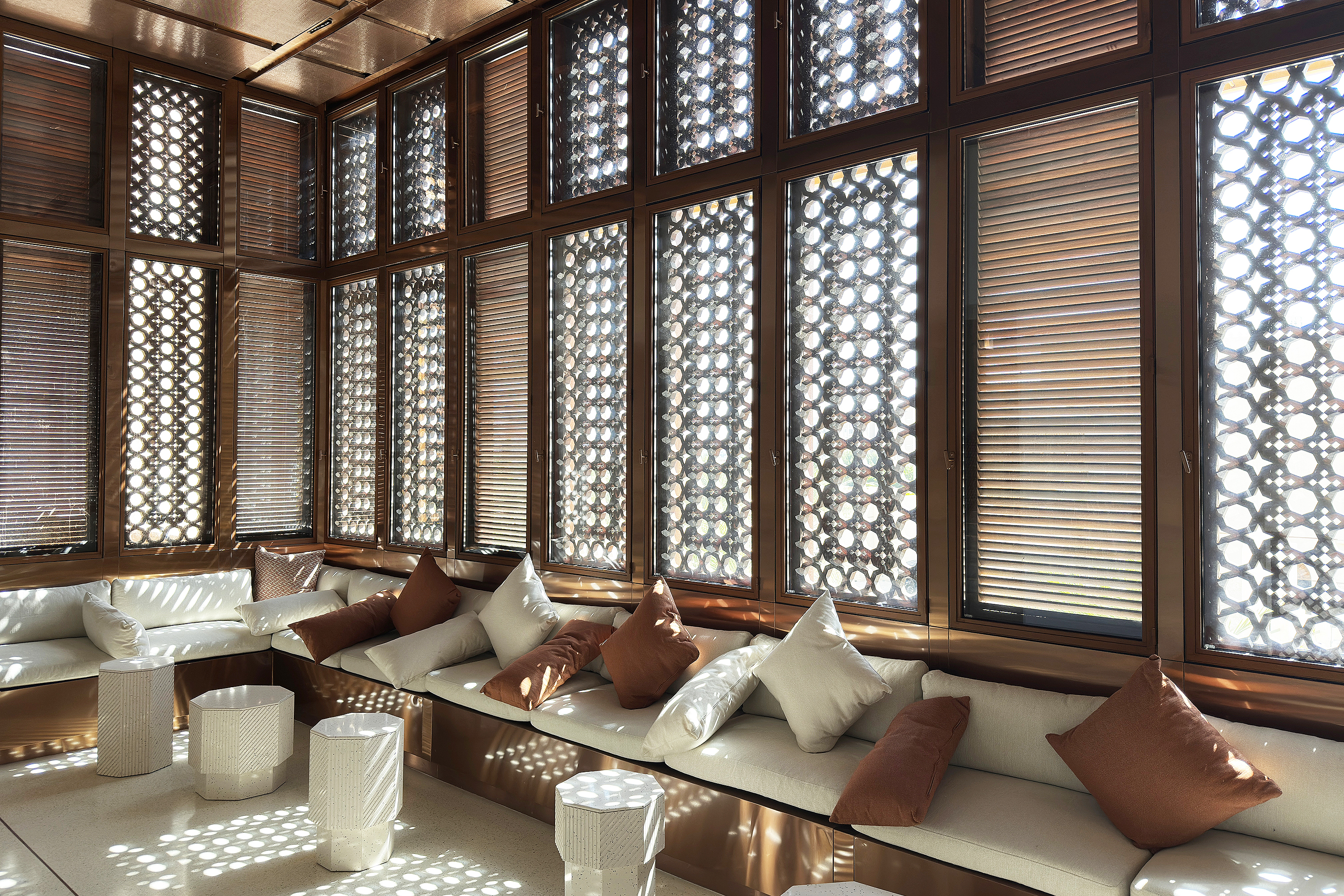 moody interior space featuring geometric wiindow coverings