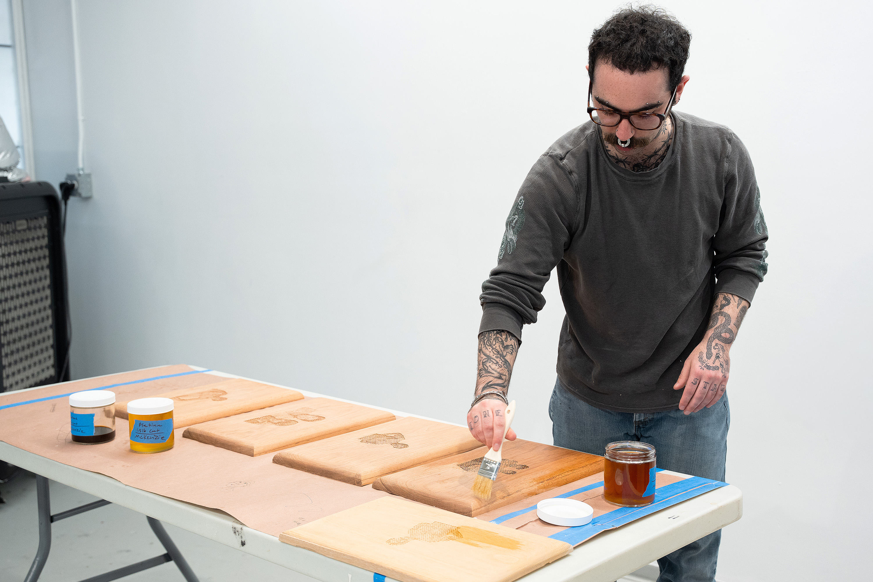 painting shellac on CNC-made wooden panels