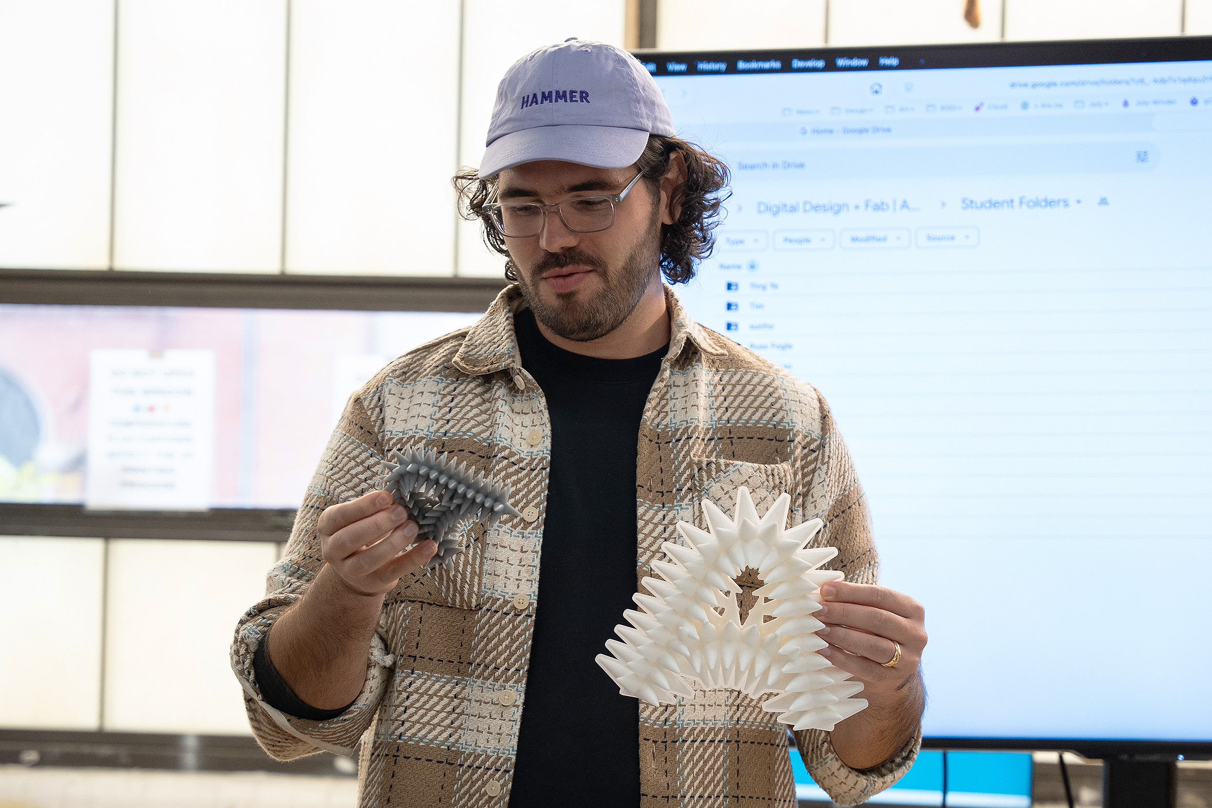 a student presents spiky letterforms to the class