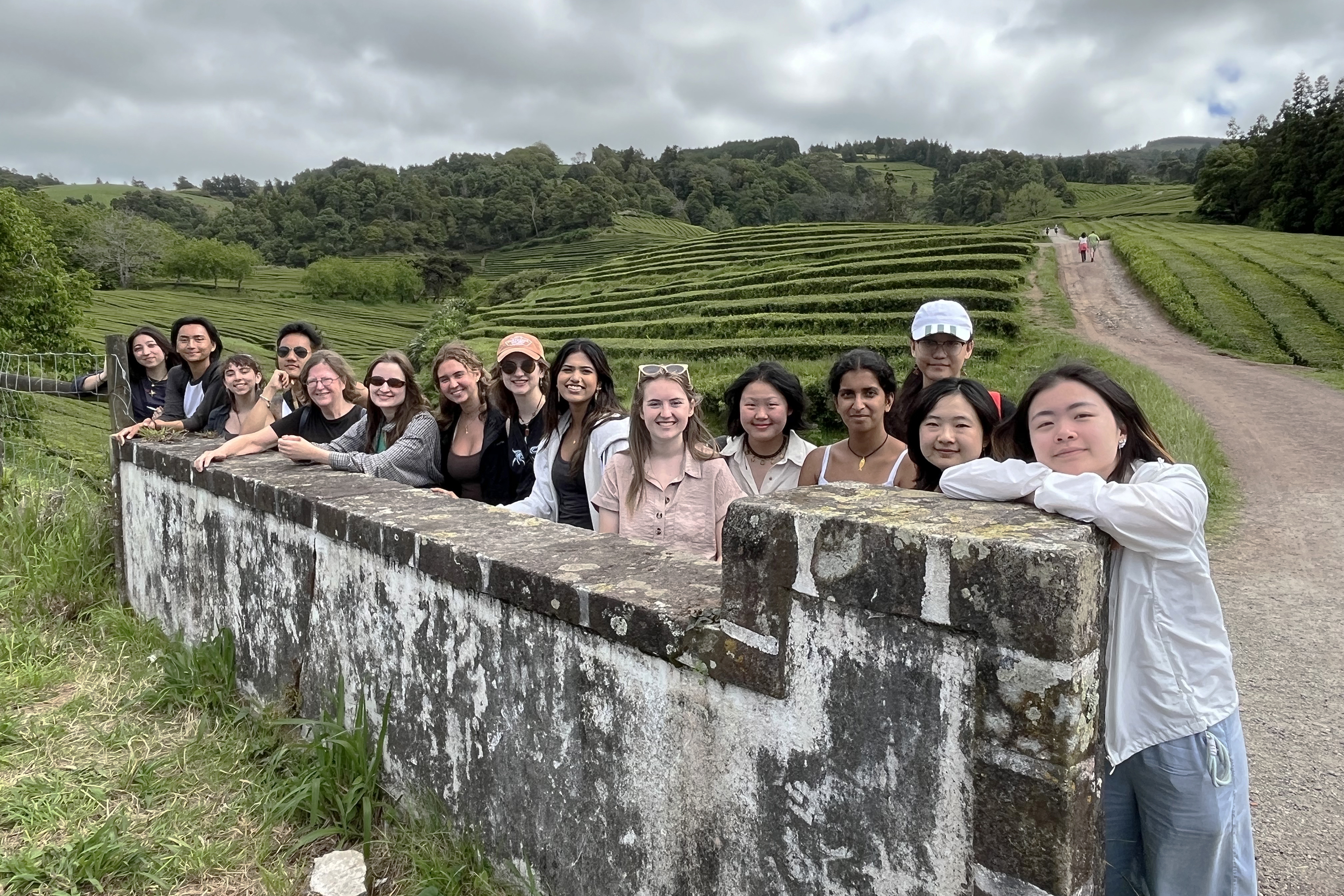 Laura Briggs poses with students and collaborators at the farm