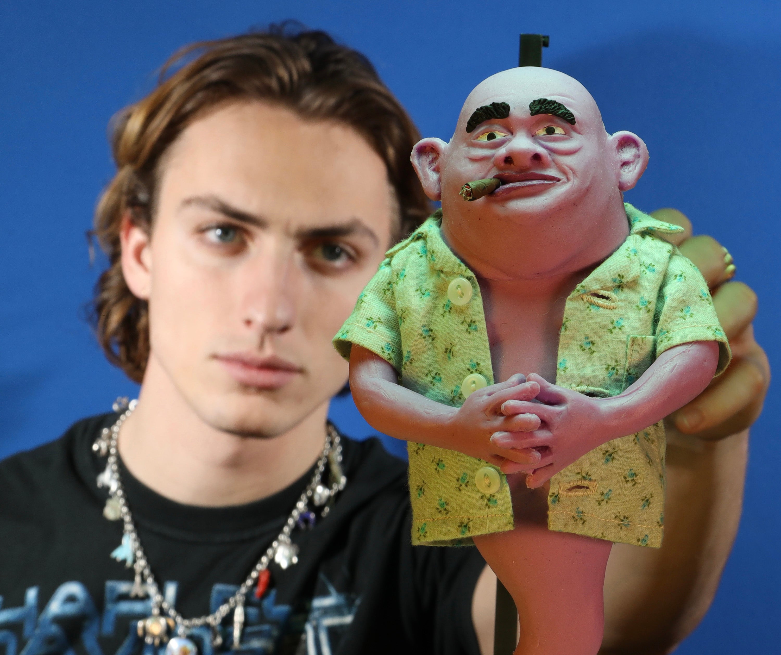 Ansel holding puppet of the Genie