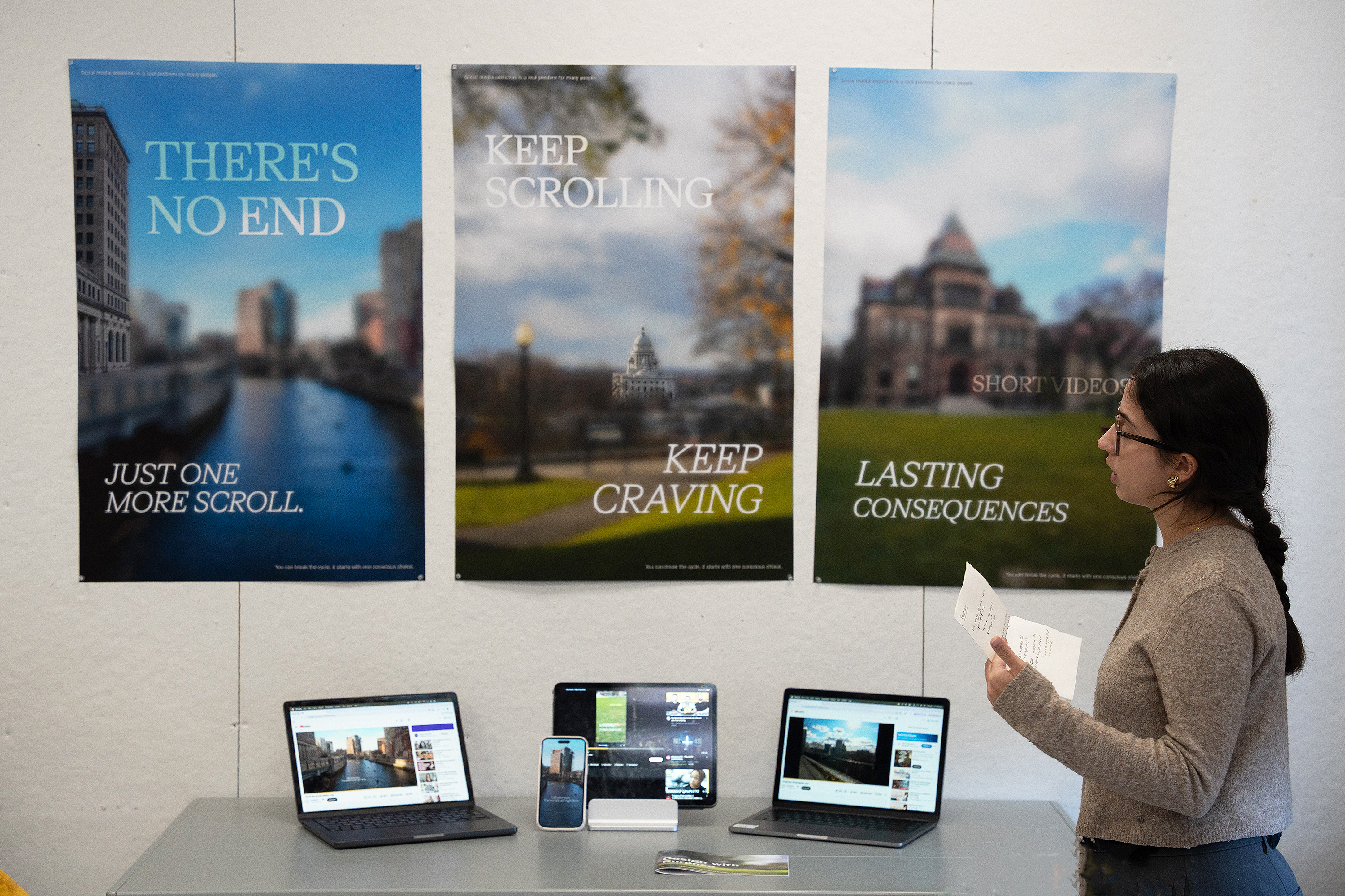 a Graphic Design undergrad shows a campaign she has created to alert people to the dangers of scrolling on their iphones