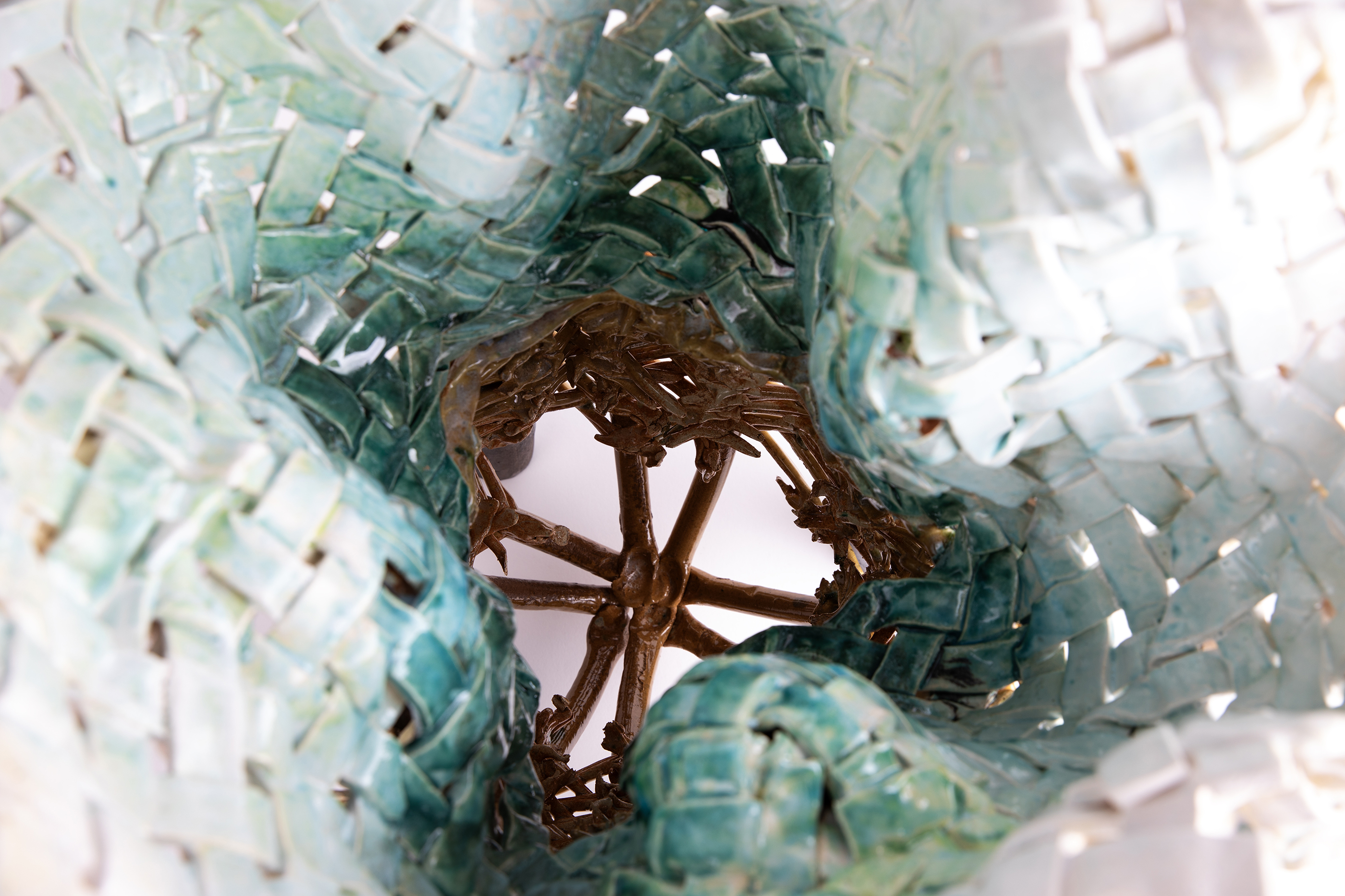 detail of woven piece in shades of white and aqua