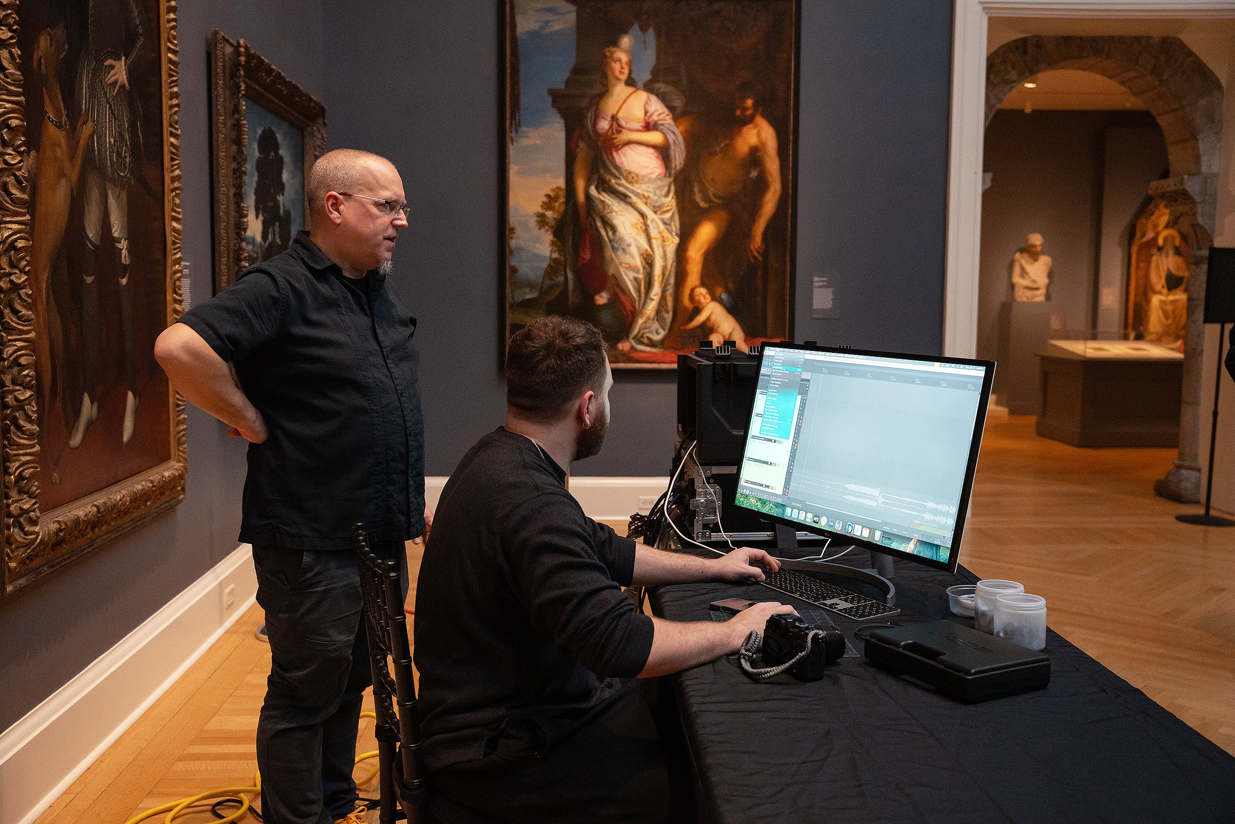 Shawn Greenlee works with sound engineer inside the RISD Museum's Grand Gallery