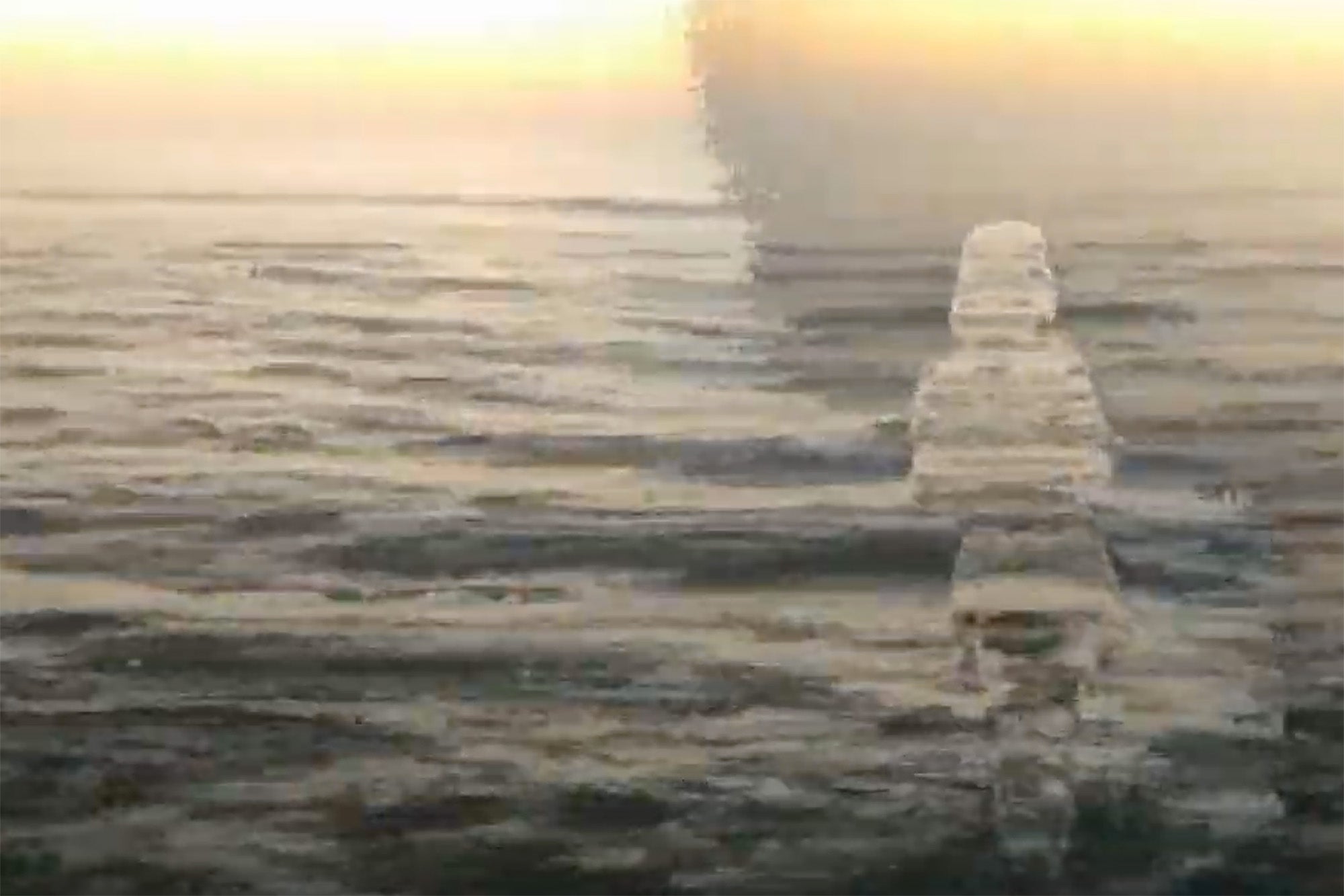 still transposing human figure over ocean waves