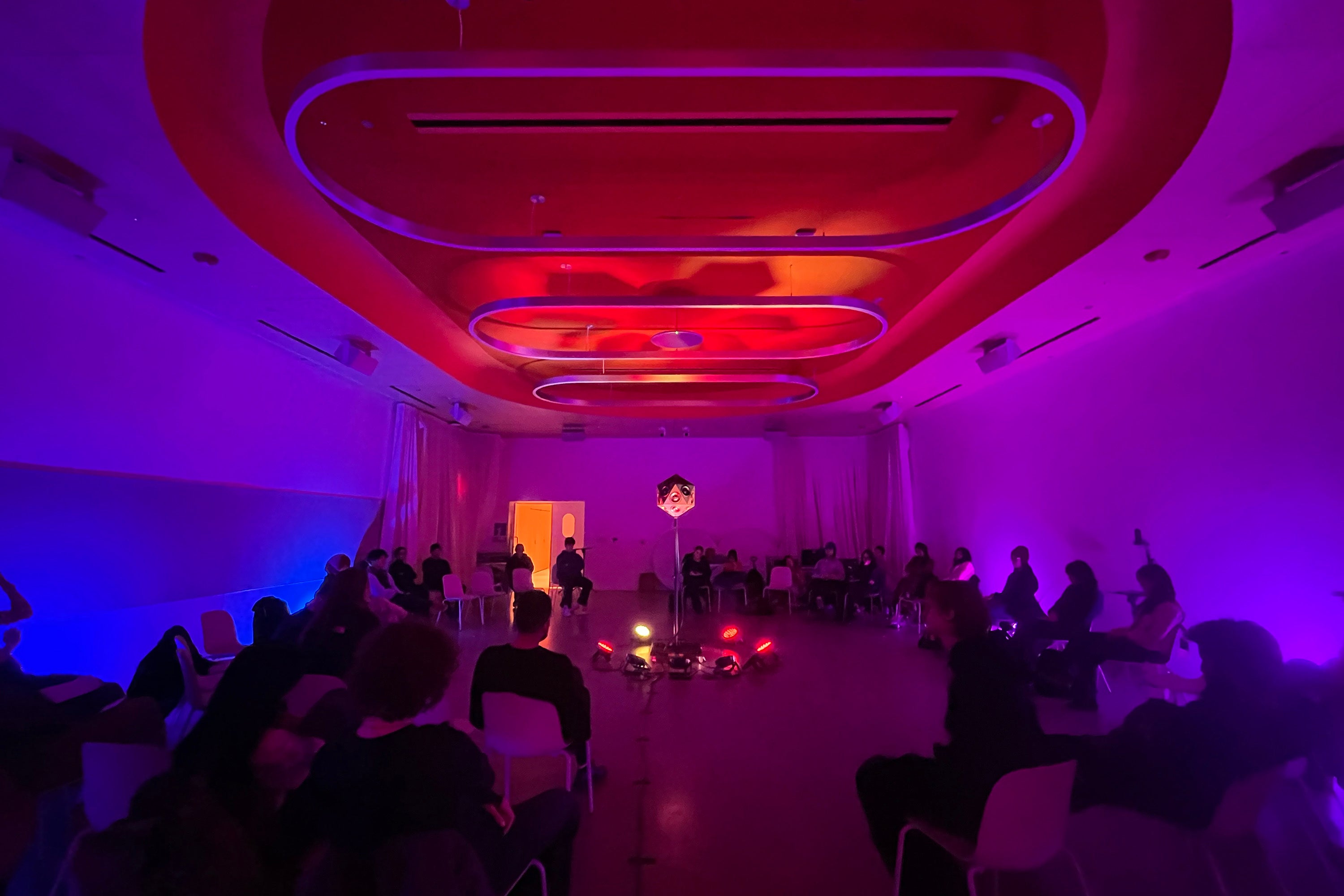 listening session in 20 Washington Place with pink ambient lighting