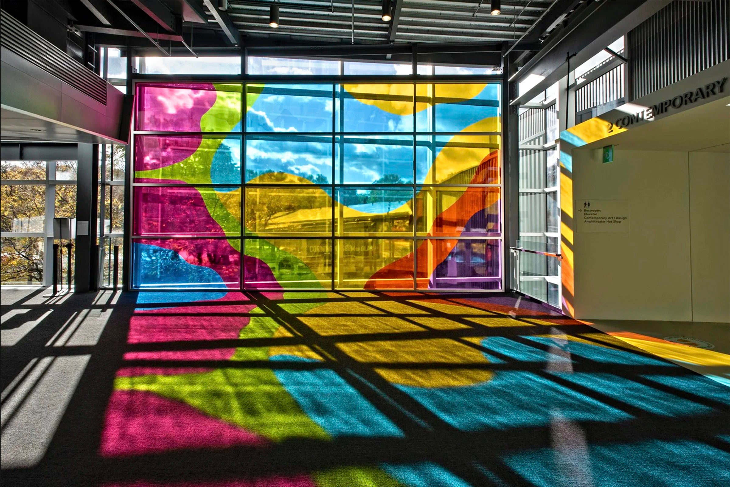 window installation casting rainbow of colors on the floor