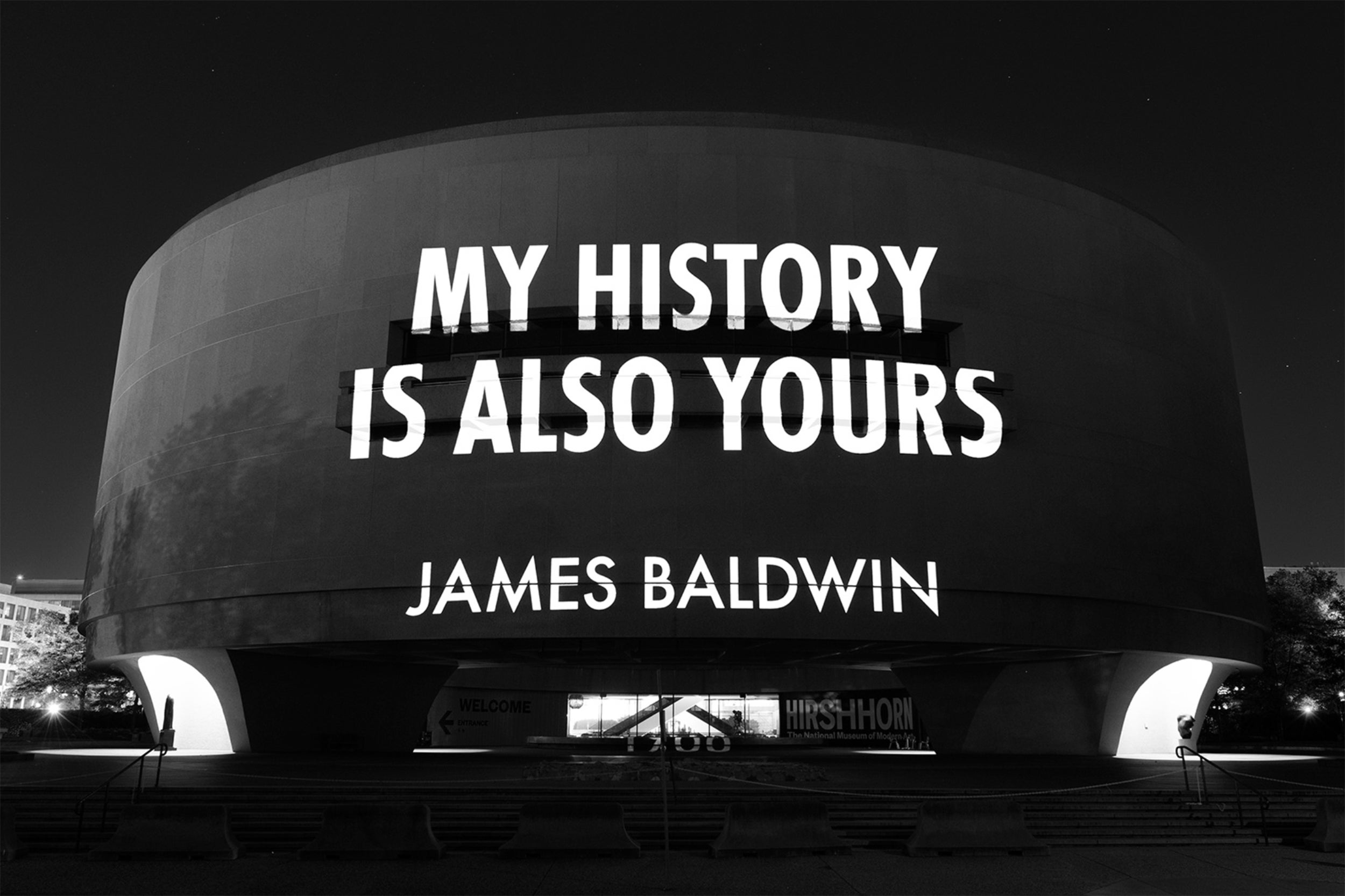 Jenny Holzer projection of quote by James Baldwin