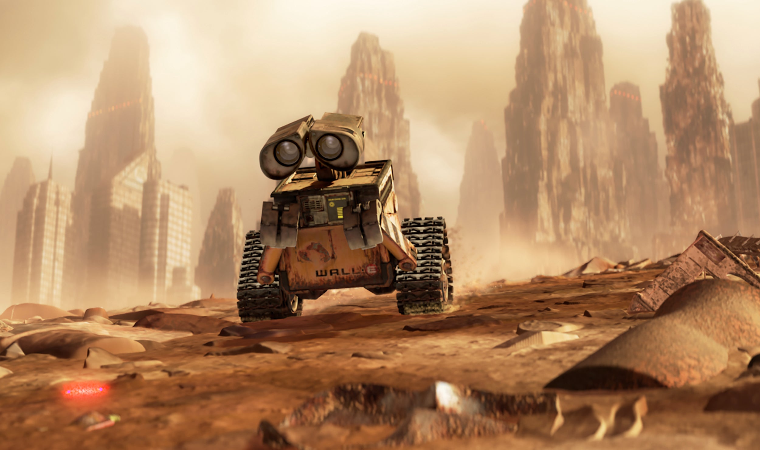a sad-looking WALL-E rolls through the wreckage