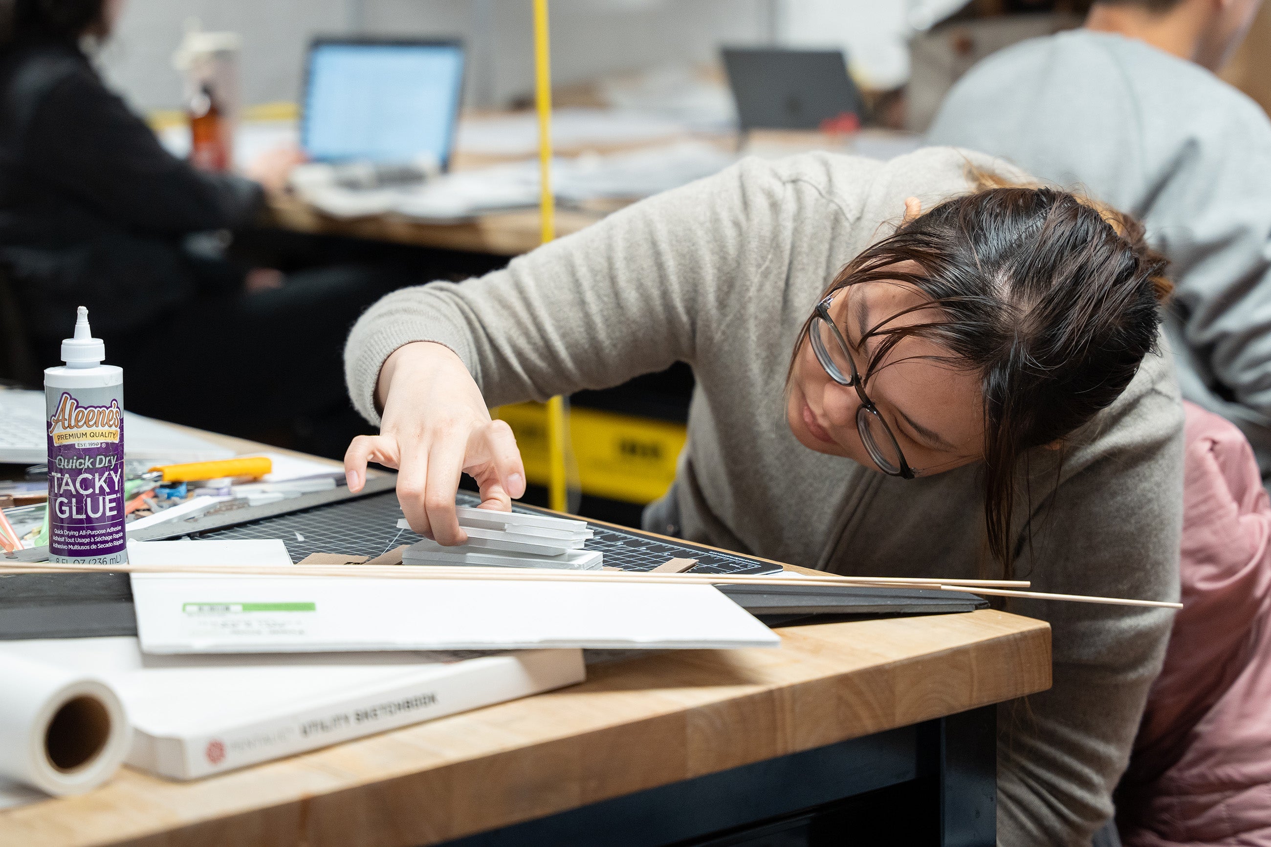 a student working with analogue materials in studio