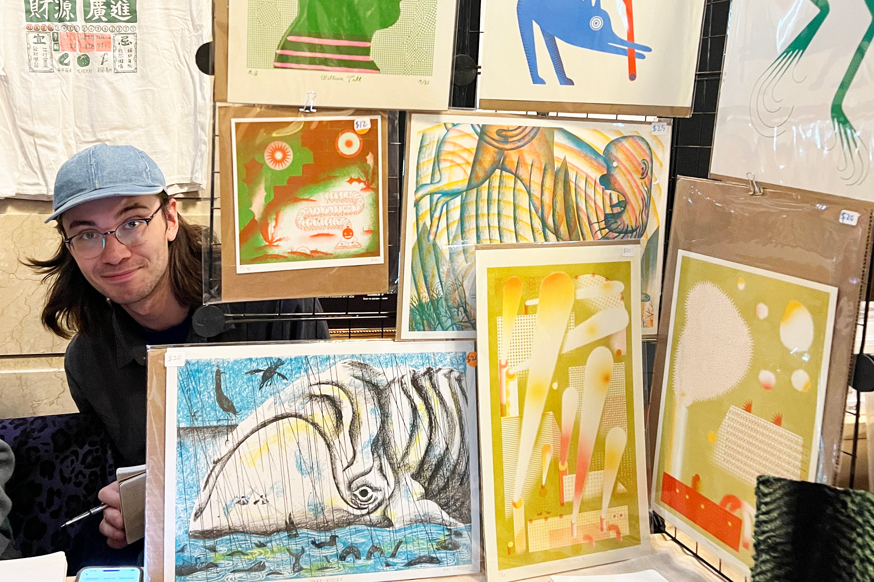 exhibitor Kai Gietzen peeks out from behind his display