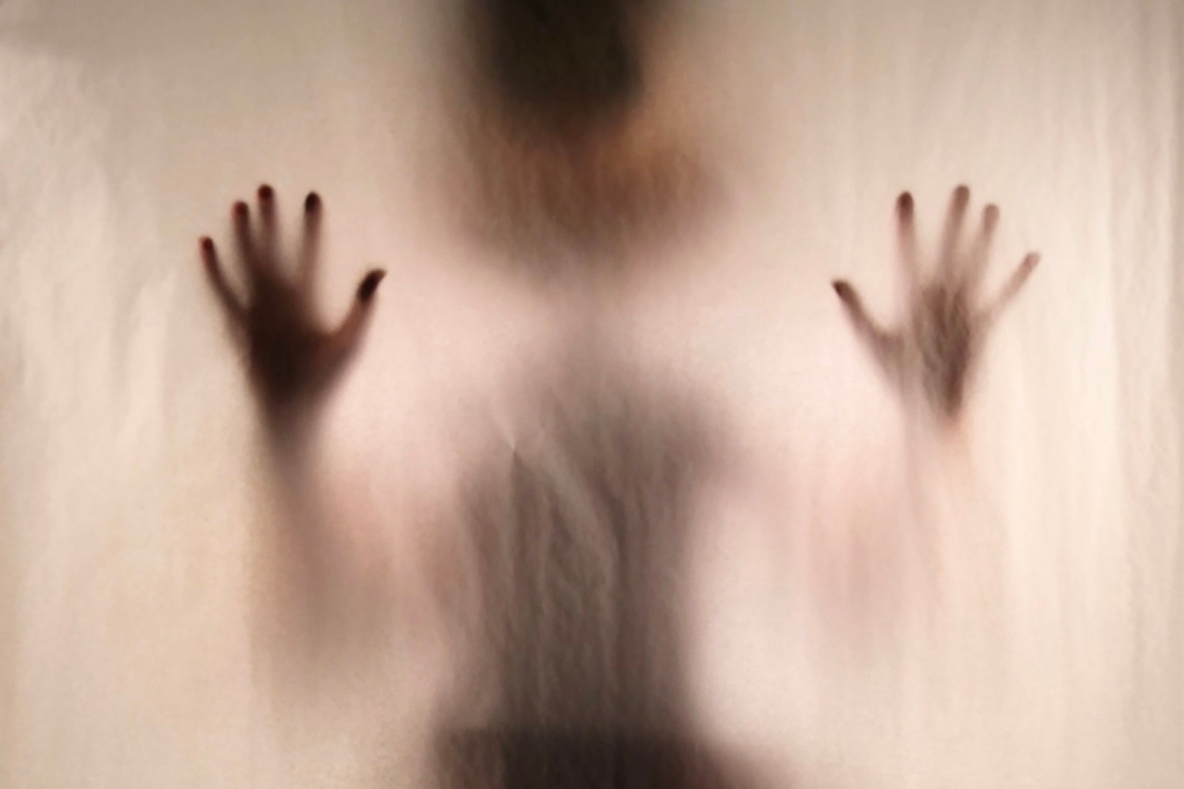installation showing a vague person through gauze