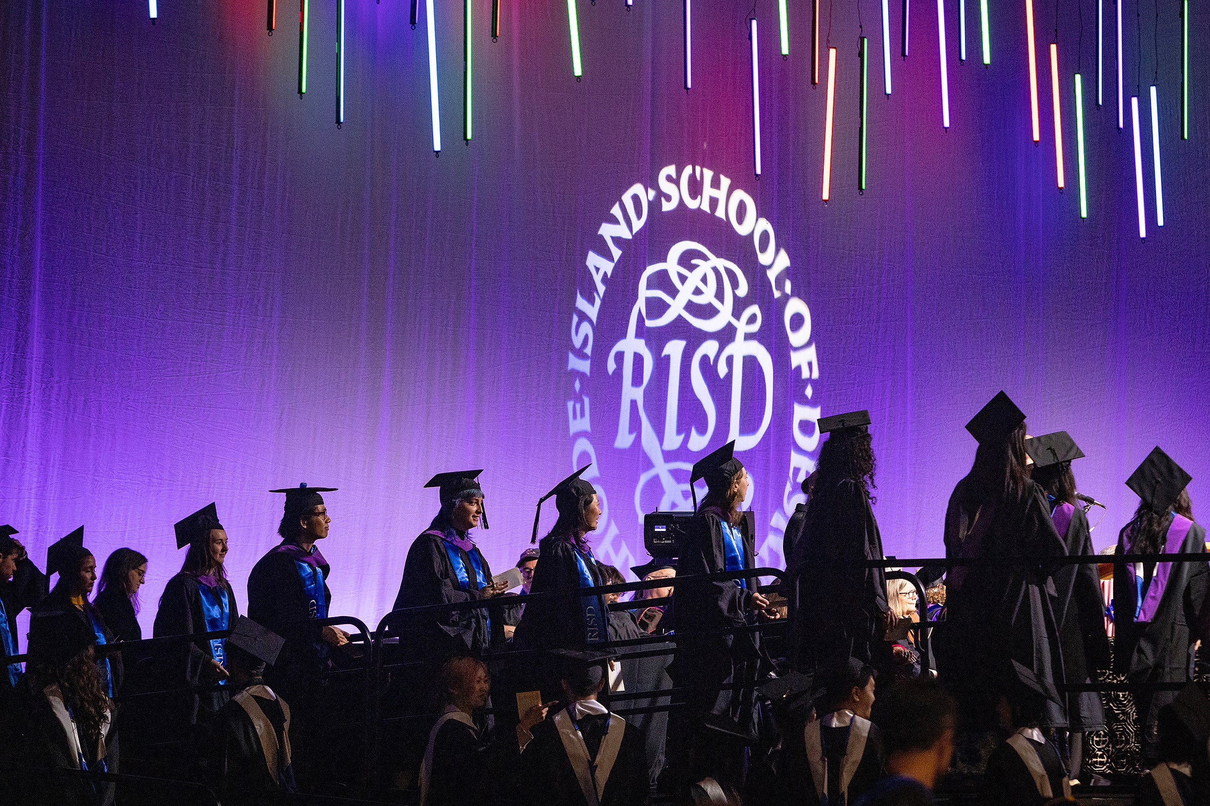 students line up to receive their degrees