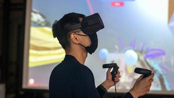 Student using virtual reality headset and controllers