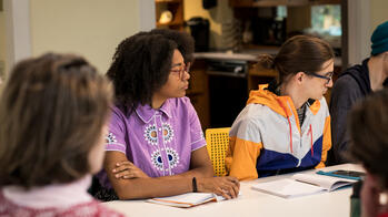 Students-sitting-around-table-during-LAS-class.