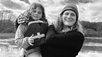 Tryn Collins holding a young child