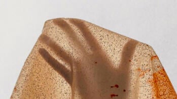 the shadow of a hand through fabric