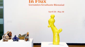 image of gallery entry with bright yellow abstract piece in the foreground