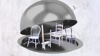 a waiter's cloche lifted to show furniture on the menu beneath