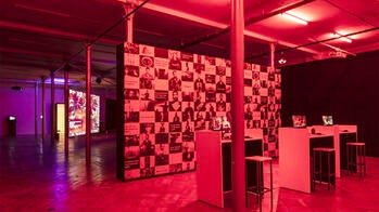 a room-sized installation in red lighting