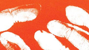 white fingertips silhouetted against an orange background