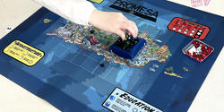 a hand poised over a board game
