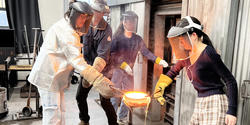 students work together in the hot shop