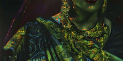 detail of tightly cropped image of woman in beautiful green sari