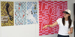 a student presents a three-poster series in crit