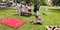 people gather outside for an art show event