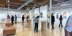 people viewing art in a gallery