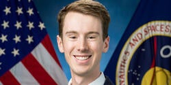 Skye Ray official NASA portrait with flags