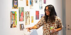 visiting scholar Mala Iqbal presents a wall of small drawings