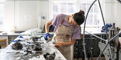 a student at work in the Printmaking shop
